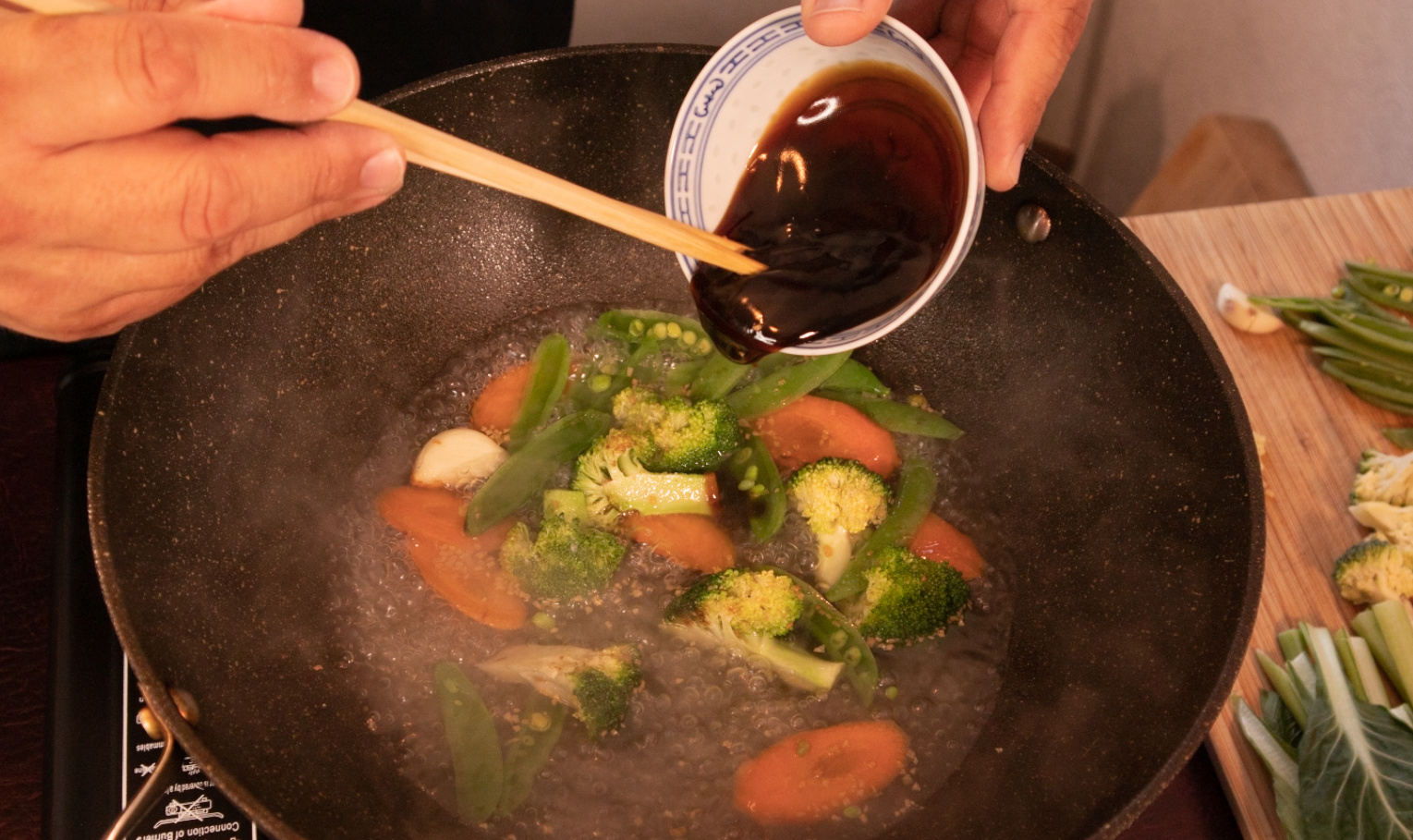 Making the sauce in a wok